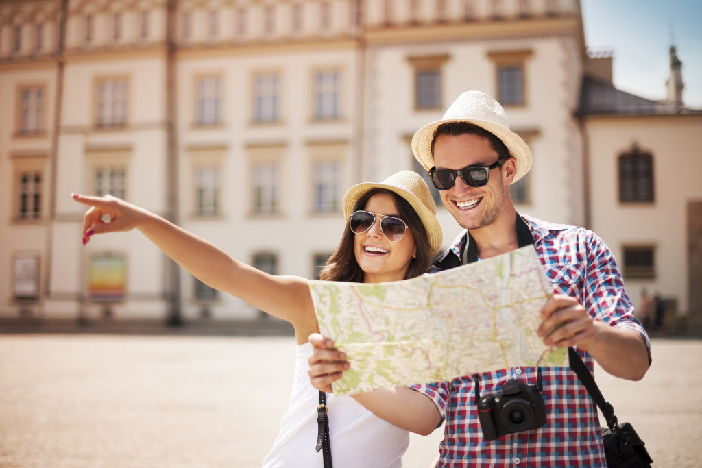 two tourists with city map