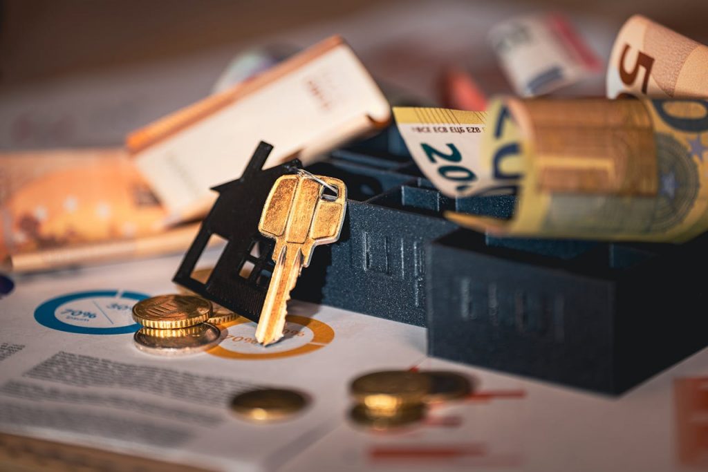 Keys, passport, and international currency symbolizing overseas property financing for US buyers